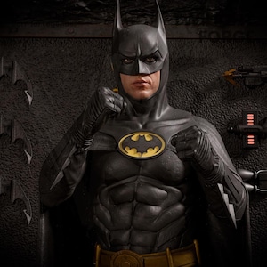 May include: A detailed statue of Batman in his classic black and gray costume. The figure features a yellow and black bat symbol on the chest, a utility belt, and a cowl with pointed ears. The statue is posed with clenched fists.