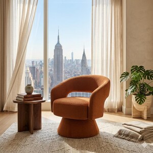 May include: An orange swivel chair with a rounded back and armrests. The chair sits on a pedestal base. A small wooden side table with books and a vase is next to the chair. A large window with a city view is in the background.