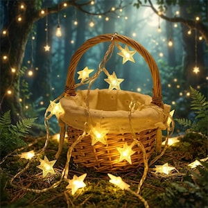 May include: A woven wicker basket with a handle is adorned with a string of glowing star-shaped lights. The basket sits on mossy ground, with more star lights scattered around. The background features a forest with soft, ambient lighting.