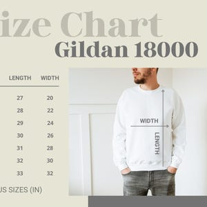 May include: White Gildan 18000 sweatshirt with a size chart. The chart shows measurements in inches for sizes S to 4XL. The image includes a person wearing the sweatshirt, with width and length measurements indicated.