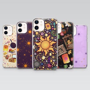 May include: Five phone cases with colorful designs. The cases feature images of a sun, lanterns, flowers, and other illustrations. The cases are in various colors, including purple, black, and yellow.