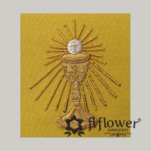 May include: Embroidered gold chalice with a white host and cross, radiating sunbeams, on a yellow background. The chalice is intricately detailed with gold thread. The image includes the text "flower EMBROIDERY".
