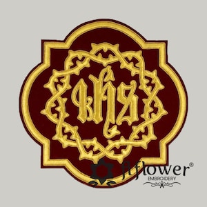 May include: A maroon and gold embroidered patch featuring the IHS monogram within a decorative gold border. The patch has a quatrefoil shape and is likely used for religious or ceremonial purposes. The embroidery is detailed and the colors are rich.