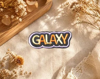 Colorful Bubble Letter Embroidered Iron‑On Patch, Pastel Multicolor Text Badge, Space Theme Sew‑On Applique for Backpack Hoodie.