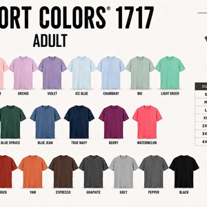 May include: Comfort Colors 1717 adult t-shirt colour chart featuring twenty-eight short-sleeve shirts in various colours with labels including white, ivory, blossom, orchid, violet, ice blue, chambray, bay, light green, seafoam, moss, blue spruce, blue jean, true navy, berry, watermelon, crimson, red, brick, yam, espresso, graphite, grey, pepper, and black, plus a size chart with width and length measurements in inches.