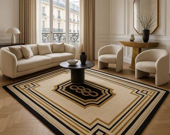 May include: A living room featuring a beige sofa, two armchairs, and a round coffee table. A large rug with a black, gold, and beige geometric pattern is centered on the floor. A gold-framed mirror and a table with a vase are also visible.