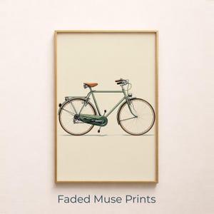 May include: A framed print of a vintage green bicycle with a brown leather saddle and handlebars. The bicycle has cream-coloured tyres and is set against a cream background. The text "Faded Muse Prints" is at the bottom.