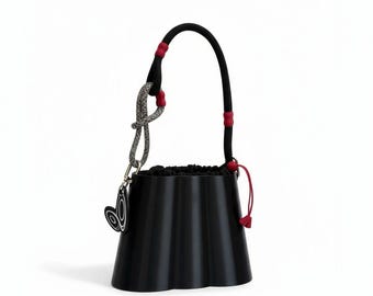 Black handbag with cherry red details and butterfly charm- 3D printed