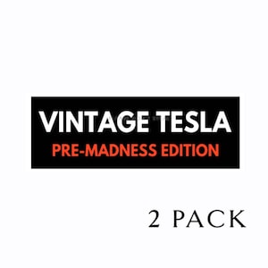 May include: A black and white sticker with the text "Vintage Tesla Pre-Madness Edition" in white letters on a black background. The sticker is rectangular and has rounded corners. Below the sticker is the text "2 PACK" in red letters.