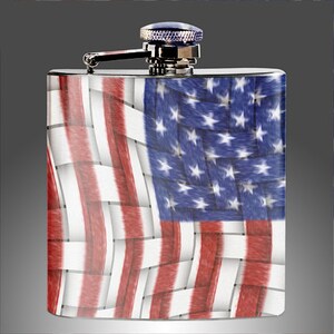 May include: A stainless steel hip flask with a woven American flag design. The flag is red, white, and blue with a woven texture.