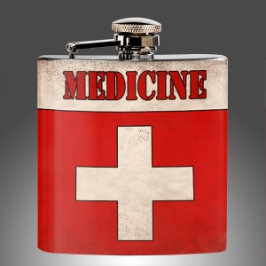 Könnte beinhalten: Eine Edelstahl-Trinkflasche mit einem rot-weissen Schweizer-Flaggen-Design. Die Flasche hat einen silbernen Verschluss und die Aufschrift "MEDICINE" auf der Vorderseite.