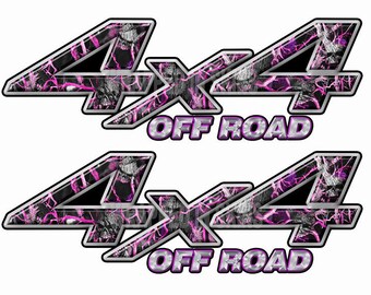 May include: Two pink and black camouflage 4x4 off-road decals. The decals have a silver outline and a pink and black camouflage pattern with a lightning bolt design.