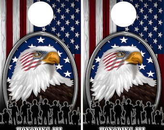 May include: Two wooden cornhole boards with an American flag design. The boards feature a bald eagle with an American flag on its chest, a line of soldiers in silhouette, and the text "All Gave Some, Some Gave All" and "Honoring All Those Who Served".