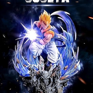 May include: A dynamic statue of Gogeta, a character from Dragon Ball, in a fighting pose. The figure has spiky yellow hair, a blue and orange outfit, and is surrounded by blue energy effects. The base is a detailed, ornate structure with chains.