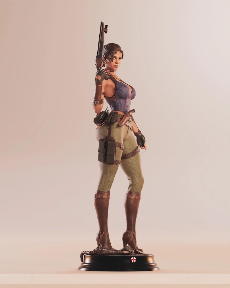 May include: A detailed figurine of a woman in a combat outfit, holding a rifle. She wears a blue and purple corset, olive green pants, and brown boots. The figurine stands on a black base with a red and white emblem.