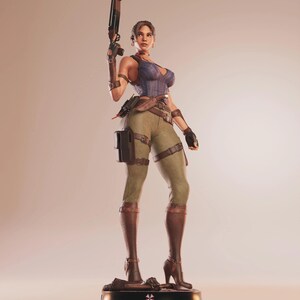 May include: A detailed figurine of a woman in combat attire, holding a shotgun. She wears a blue and purple corset, olive green pants, and brown boots. The figure stands on a black base with a white emblem.