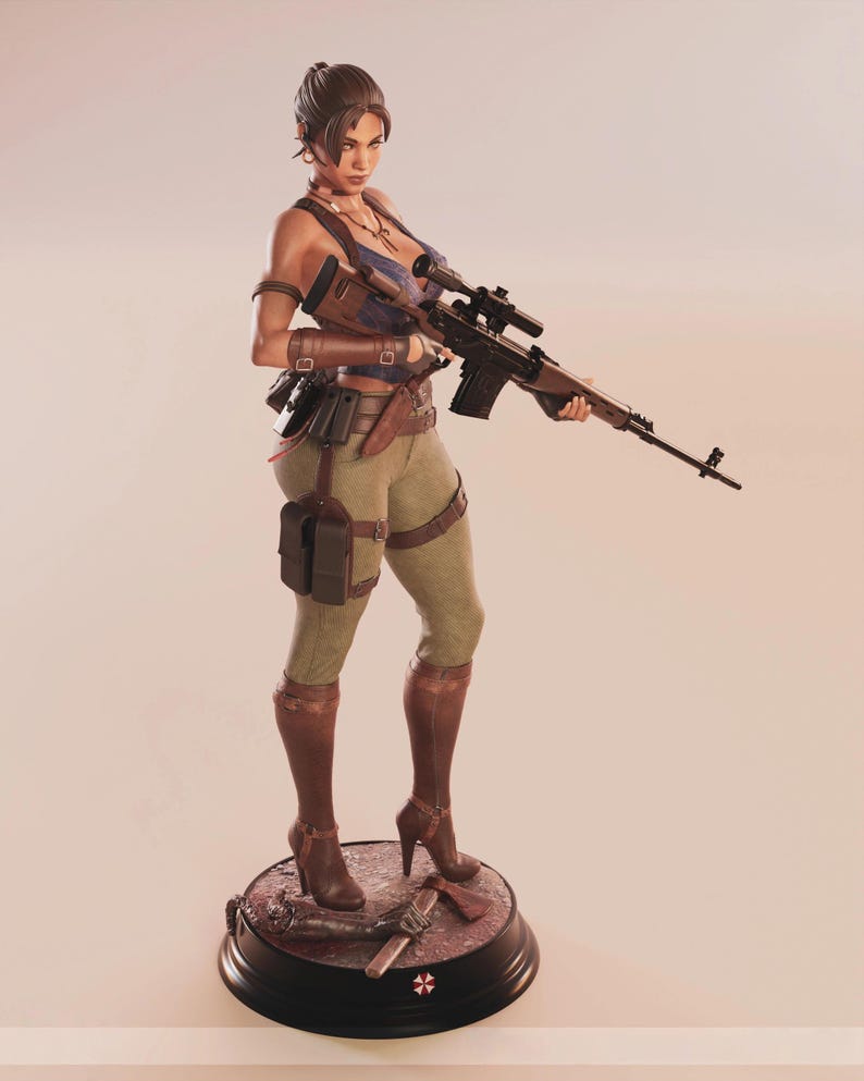 May include: A detailed figurine of a woman holding a rifle, dressed in a blue top, green pants, and brown boots. The figure stands on a base with a red and black design, and a weapon. The figurine has a serious expression.