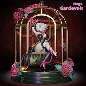 May include: A figurine of a character in a black and white outfit, seated inside a gold cage adorned with pink roses. The figurine has blue hair and is tied with pink ribbons. The text "Mega Gardevoir" is visible.