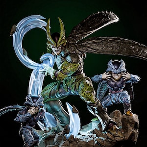 May include: A detailed figurine of a character from Dragon Ball Z, featuring a large, green, insectoid figure with large wings and two smaller figures in blue armor. The figures are posed on a rocky base with blue energy effects.