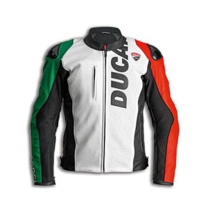 May include: A motorcycle jacket in white, black, green, and red, with the word "DUCATI" printed vertically. The jacket features a zip closure, a small logo on the chest, and green and red accents on the sleeves.