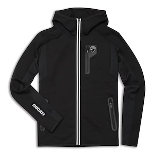 May include: A black hooded zip-up jacket featuring a white vertical stripe along the front zipper, a small Ducati logo on the left chest pocket, and the word DUCATI printed in white on the right sleeve. The garment includes two side pockets.