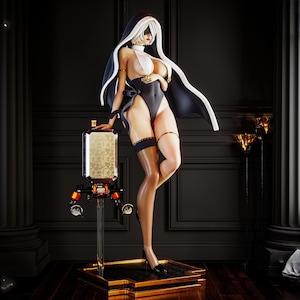 May include: A detailed figurine of a woman in a nun-inspired outfit, featuring a black and white bodysuit, veil, and blindfold. The figure is posed next to a futuristic, gold-toned device with orange accents. The statue stands on a gold-colored base.