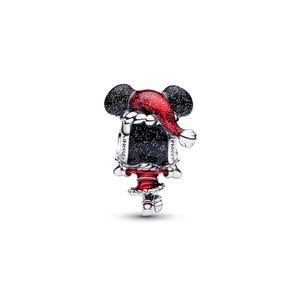 A shiny, metallic charm in the shape of a cartoon character wearing a red hat with a starry background.