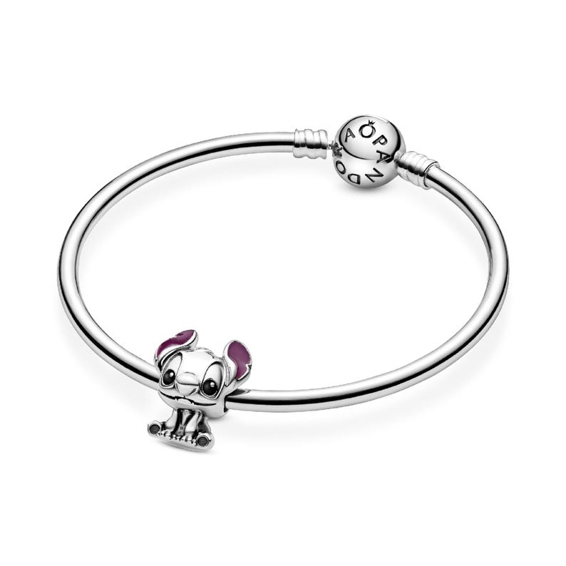 A silver-colored bracelet with a charm featuring a cartoon character, likely a character from a popular animated series.