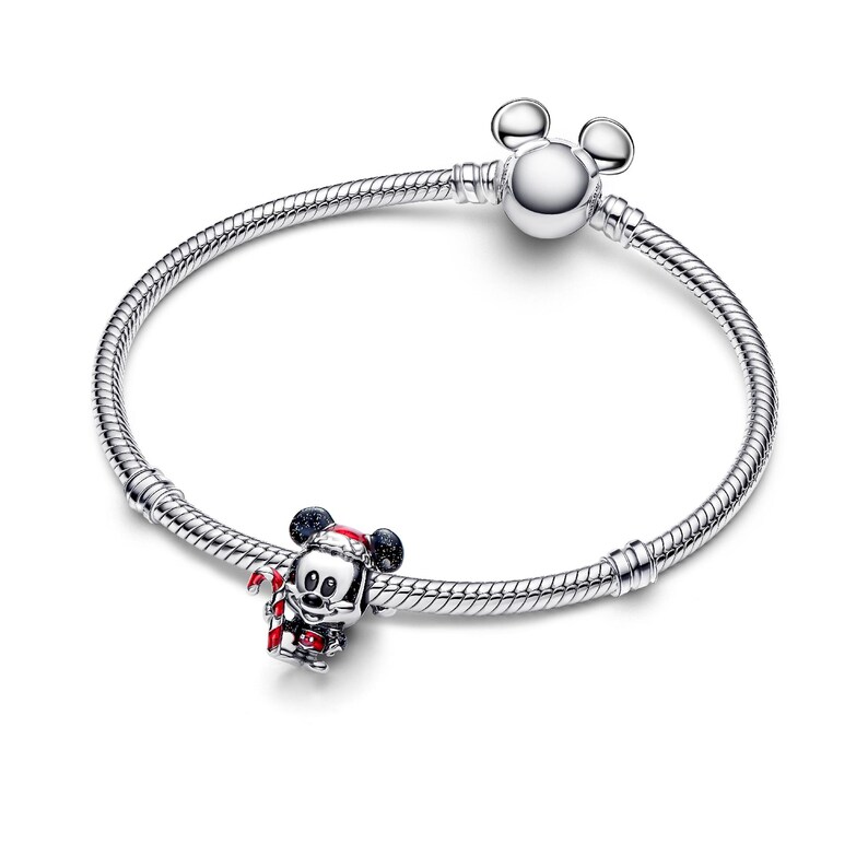 A silver bracelet with a charm featuring a cartoon character, likely Mickey Mouse, and a ball.
