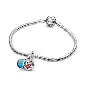 A silver-toned charm bracelet with a charm and a bead.