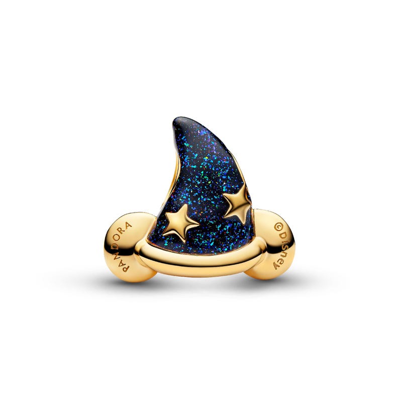 A gold-colored charm in the shape of a wizard's hat with blue glitter and stars.