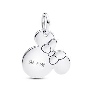 A silver charm in the shape of a Mickey Mouse with two bows, and the text "M + M" engraved on it.