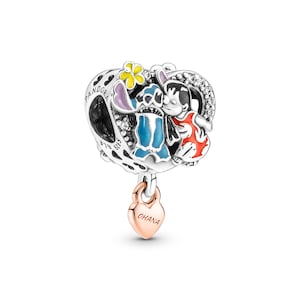 A charm in the shape of a heart with a pendant, featuring a character from the Disney movie "Stitch".