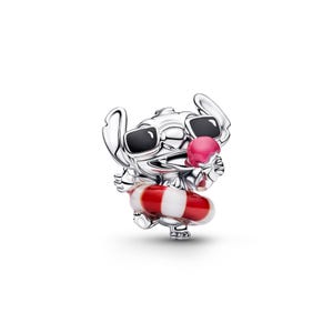 A silver charm in the shape of a cartoon character wearing sunglasses and holding a red and white striped floatie.