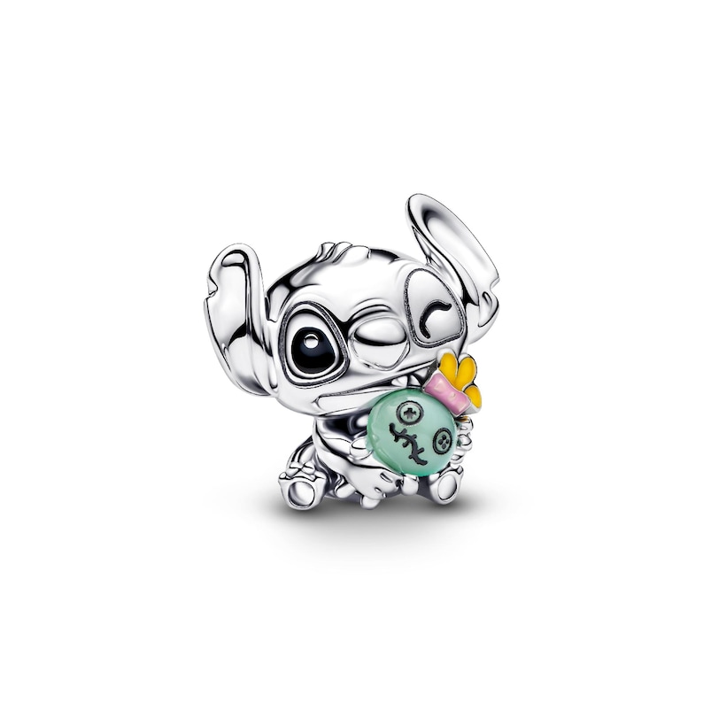 A silver-colored charm in the shape of a cartoon character, with a face and a small body.
