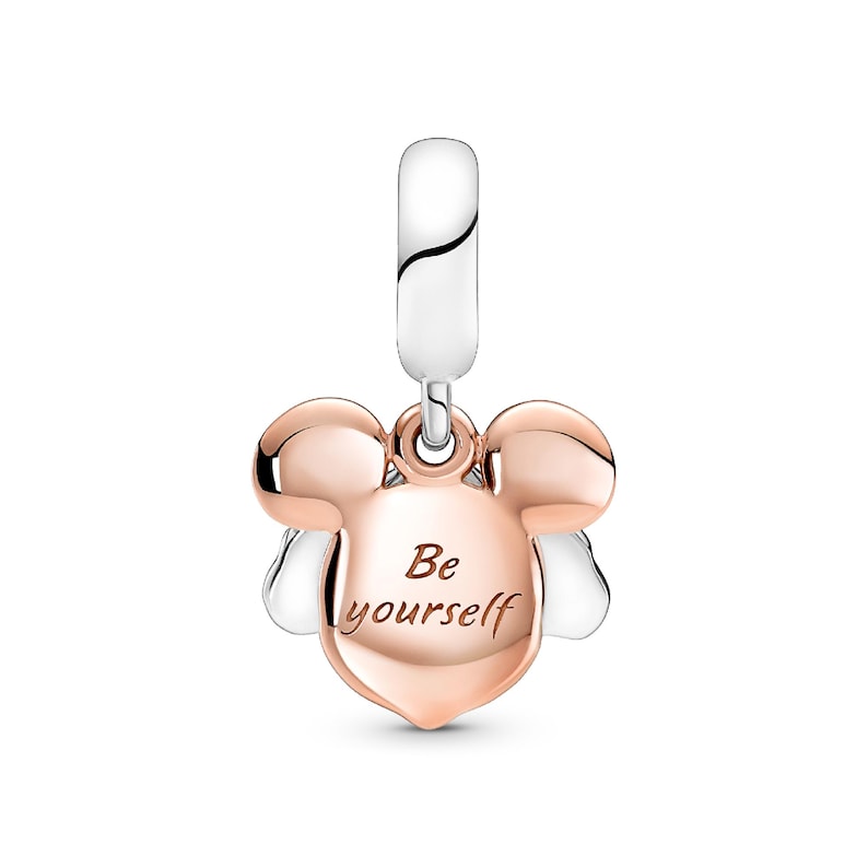 A charm in the shape of a Mickey Mouse's head with the text "Be yourself" engraved on it.