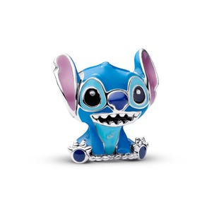 A blue plush toy resembling the character Stitch from the Disney animated film "Lilo & Stitch".