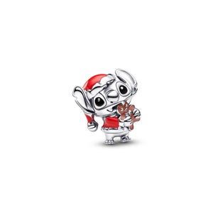 A silver-colored cartoon character wearing a red Santa hat and holding a small brown object.