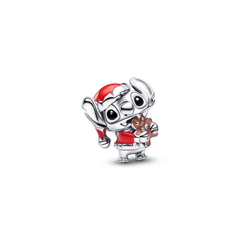 A silver-colored cartoon character wearing a red Santa hat and holding a small brown object.