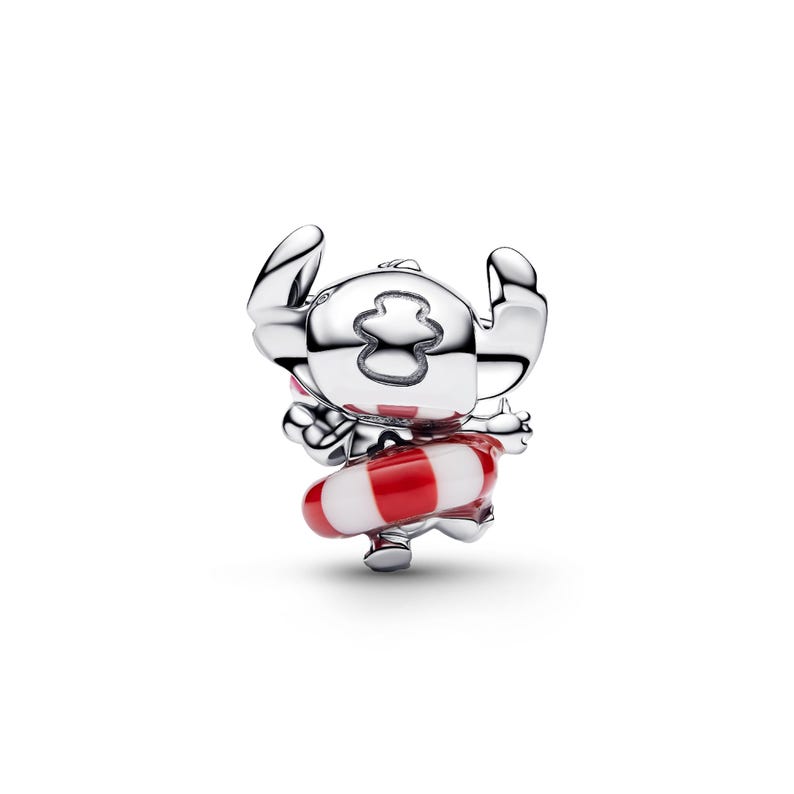 A silver charm in the shape of a cartoon character, with a red and white striped life preserver around its neck.