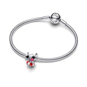 A silver-colored charm bracelet with a small charm depicting a cartoon character and a round bead on the end.