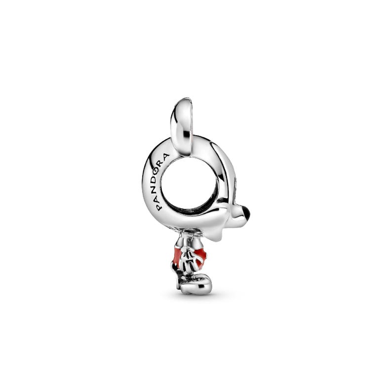 A silver-colored pendant charm with a red flower-shaped charm attached to it.