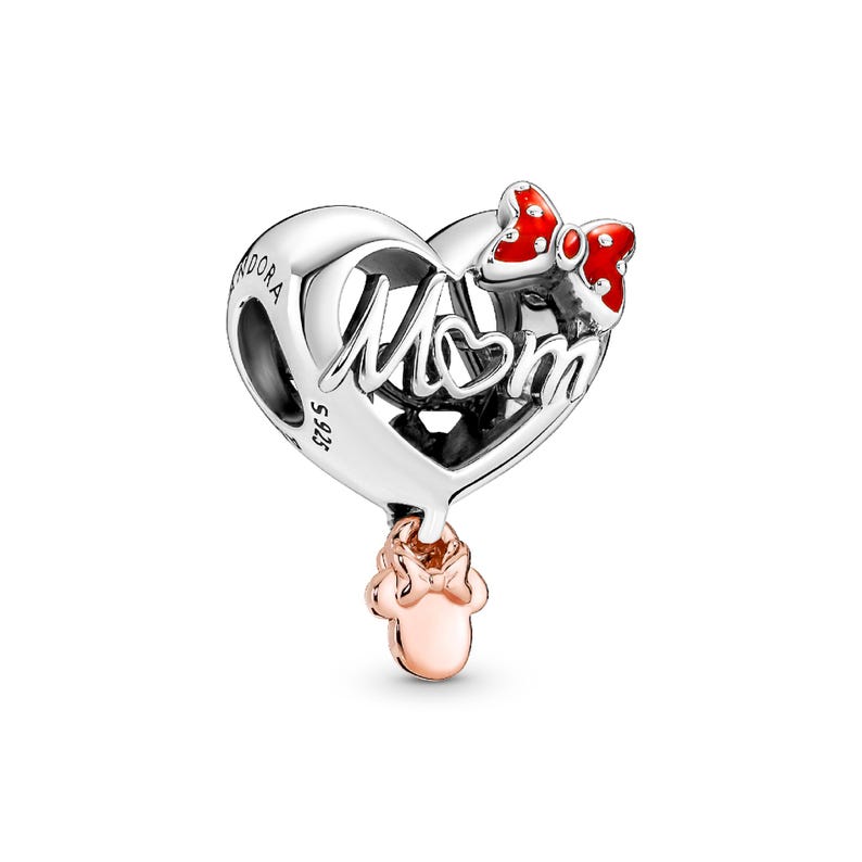 A silver heart-shaped pendant with the word "Mom" engraved on it, and a red bow charm hanging from the bottom.