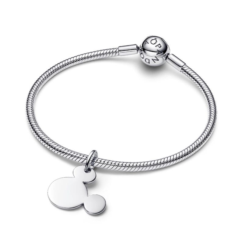 A silver-colored bracelet with a charm featuring the iconic Mickey Mouse logo.