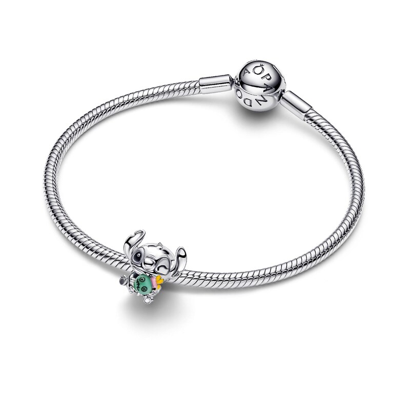 A silver-colored bracelet with a charm featuring a cartoon character.