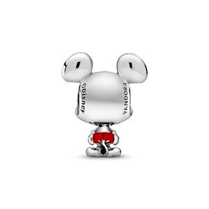 A silver charm in the shape of a cartoon mouse with a red bow around its neck.