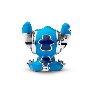 A blue and silver Stitch charm in the shape of a blue elephant.