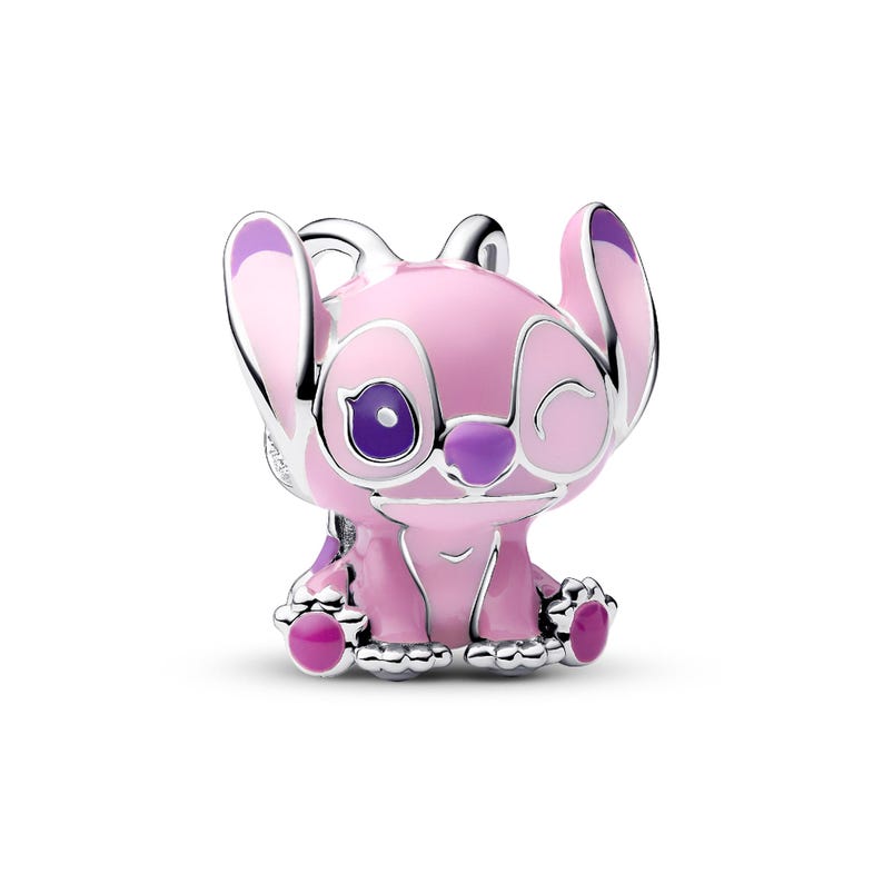 A pink and silver charm in the shape of a cartoon character with large eyes and a small nose.