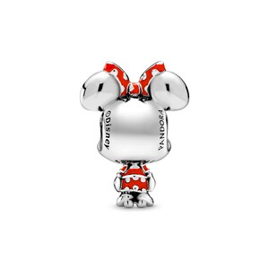 A silver charm in the shape of Minnie Mouse with a bow, featuring the word "Disney" on it.