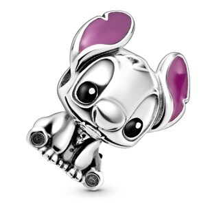 A silver charm in the shape of a cartoon dog with pink ears.